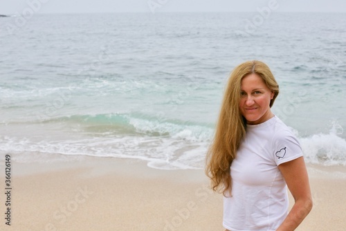 natural young woman on beach