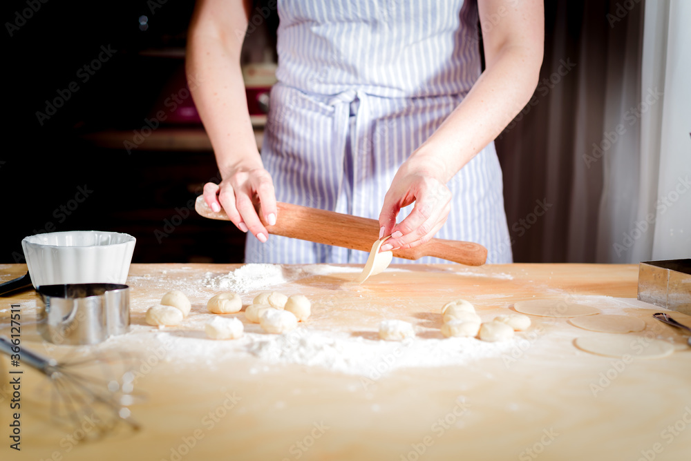 fingers on dough, chef kneads dough for baking, concept cooking, bakery