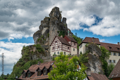 Houses built on rock  Franconian Switzerland  cloudy summer day