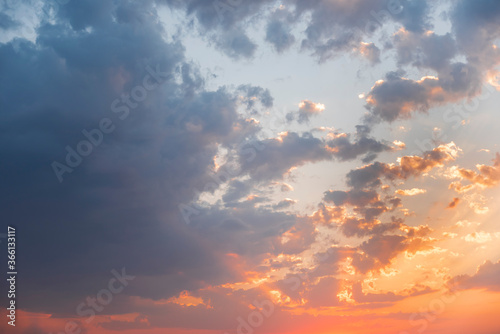 Beautiful colorful sunset sky with orange clouds. Nature sky background.