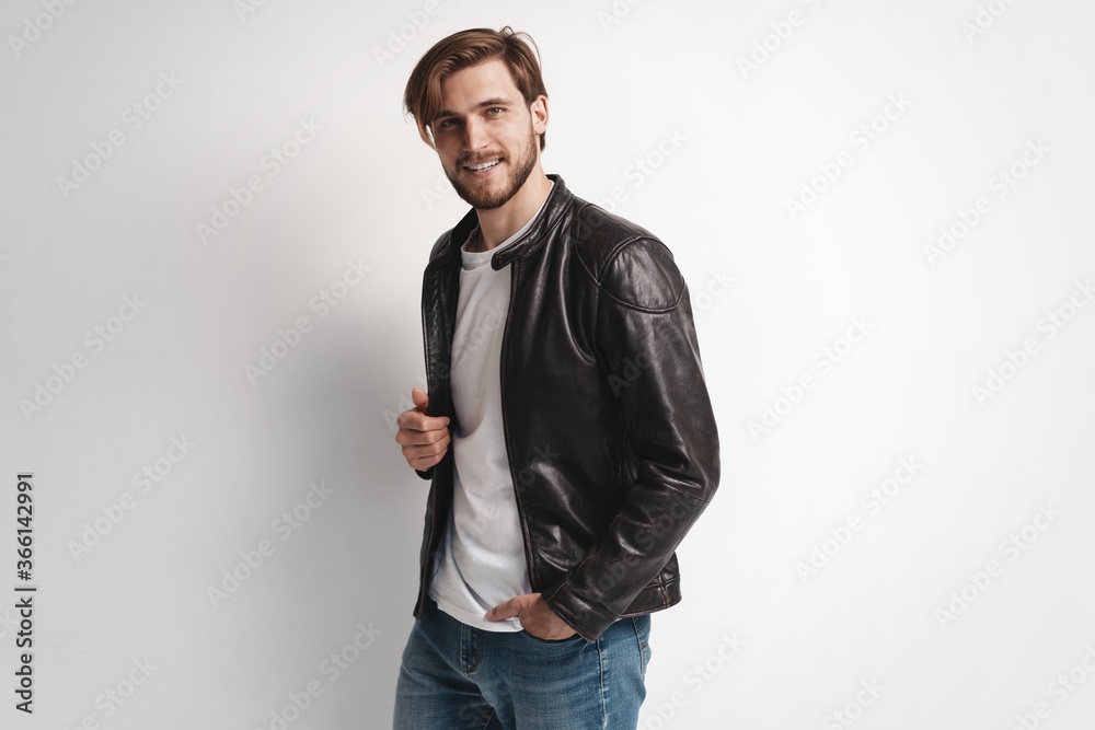 © opolja - Fashion man, Handsome serious beauty male model portrait wear leather jacket, young guy over white background