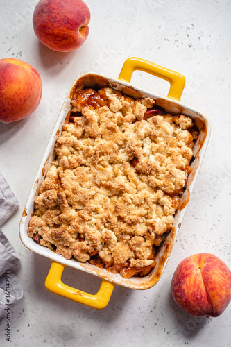 Εκτύπωση καμβά Peach cobbler dessert in a baking dish