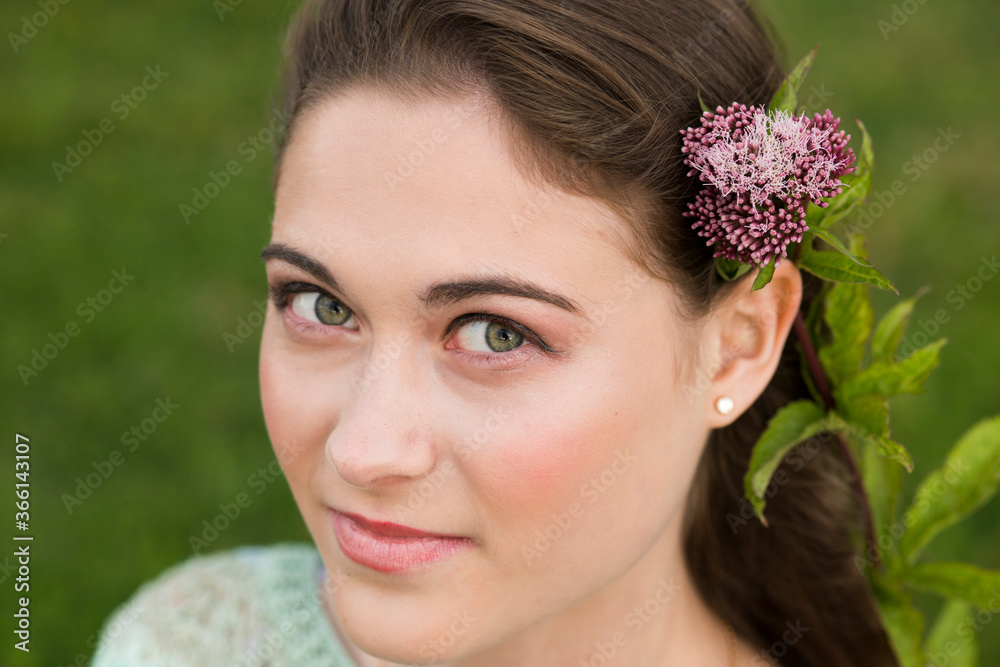 Fototapeta premium Romantic girl on an evening summer walk 
