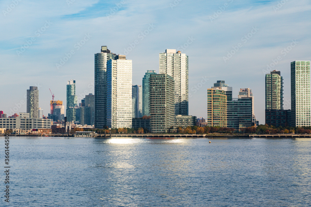 Fototapeta premium city in the background and a blue cloudy sky in summer
