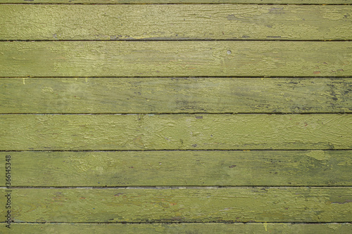 abstract background of old painted green wooden wall close up