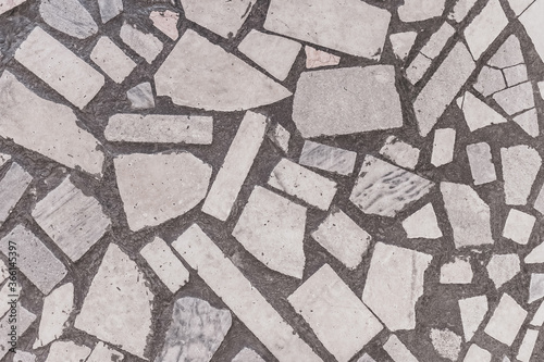 a textured background of stone pieces in concrete. soviet floor design
