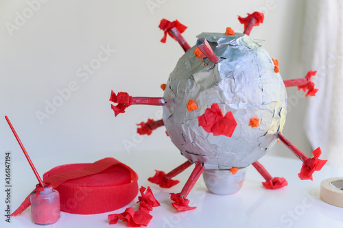 Papier mache model of coronavirus photo