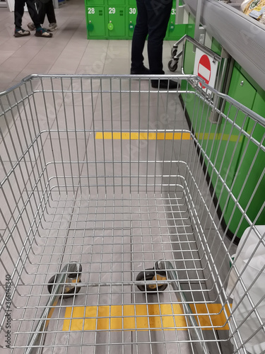 Distance markings signs on the floor in a drugstore, supermarket, shop