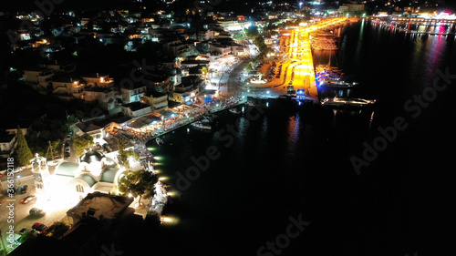 Aerial drone night shot of picturesque illuminated promenade area of Porto Heli fjord village, Argolida, Peloponnese, Greece © aerial-drone