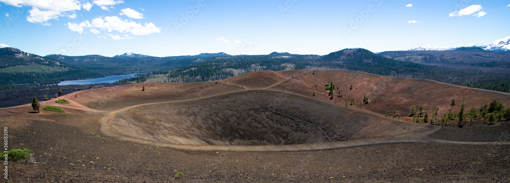 Large panorama of summit crater of Cinder Cone in Lassen Volcanic National Park in northern California. With snag lake and lassen pic with snow.