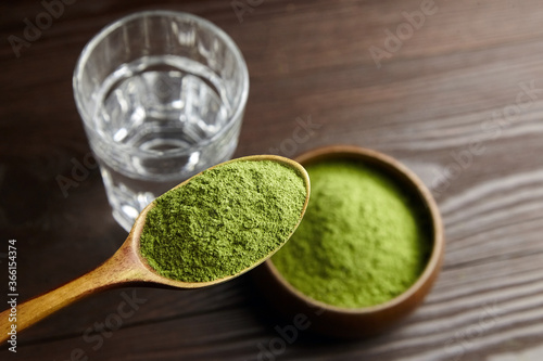 Green food supplements - wheat or barley grass powder for preparation of detox drink.