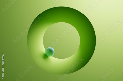 Three dimensional render of small sphere inside green ring photo