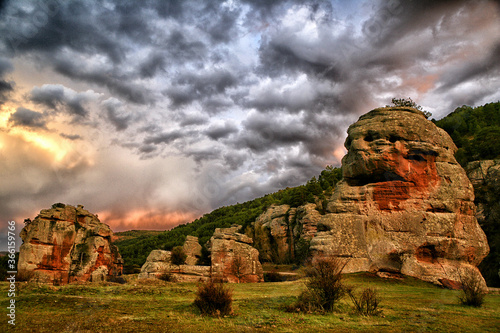 Spain, Province of Guadalajara, Chequilla, Dramatic clouds over rock formations in Castilla-La Mancha photo