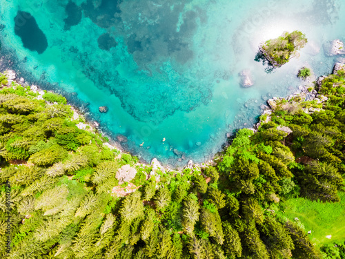 Italy, Province of Udine, Tarvisio, Drone view of turquoise Fusine Lake photo