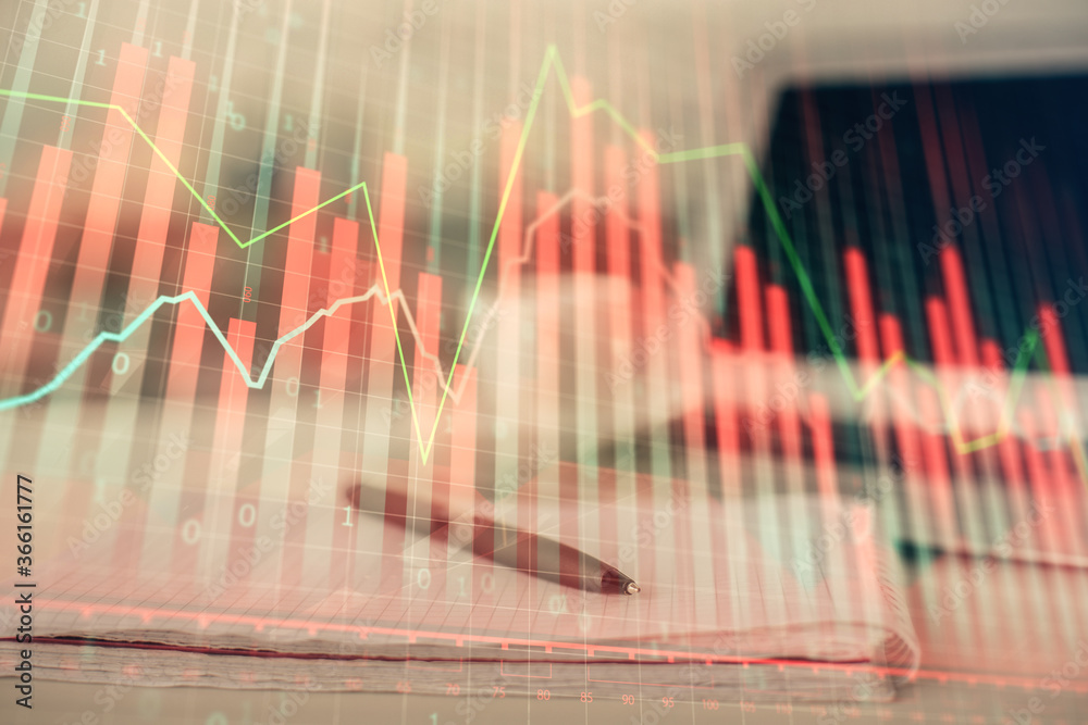 Double exposure of financial graph drawings and desk with open notebook background. Concept of forex market Double exposure of financial graph drawings and desk with open notebook background. Concept of forex market