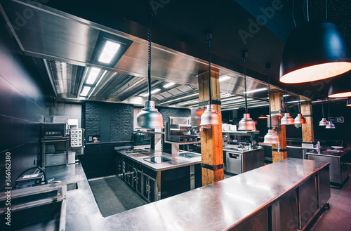 Interior of illuminated commercial kitchen in restaurant photo