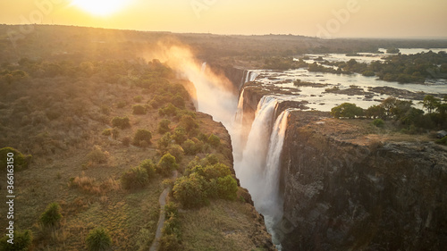 Scenic view of Victoria Falls against during sunset, Zimbabwe photo