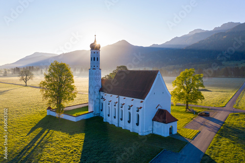 Germany, Bavaria, Schwangau, Drone view of Church of Saint Coloman at sunrise photo