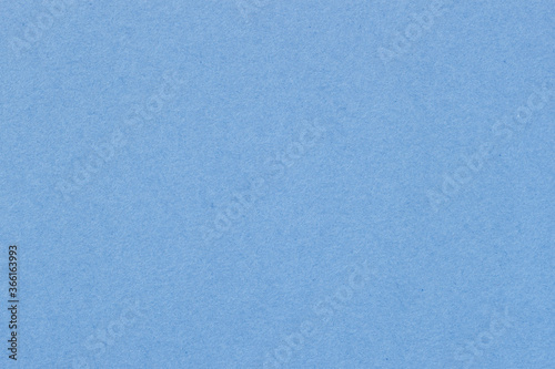 Texture of artistic paper, soft light blue color. Recyclable material. Fashionable background