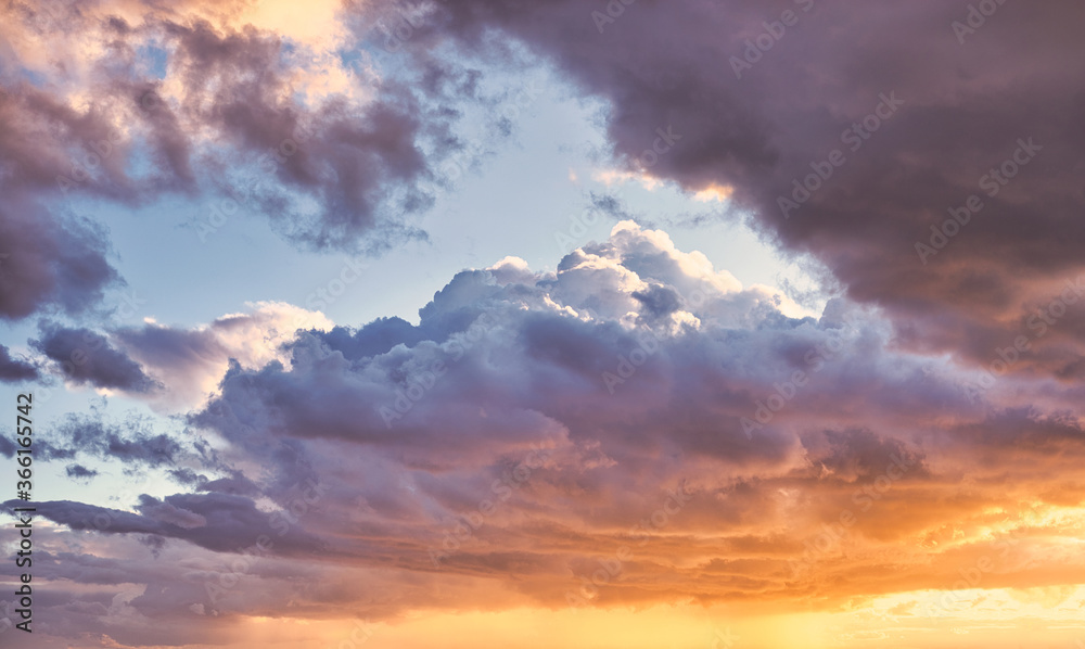 Cumulus clouds in the sky. Clouds during the sunset. Cumulus clouds in the sky. Clouds during the sunset.