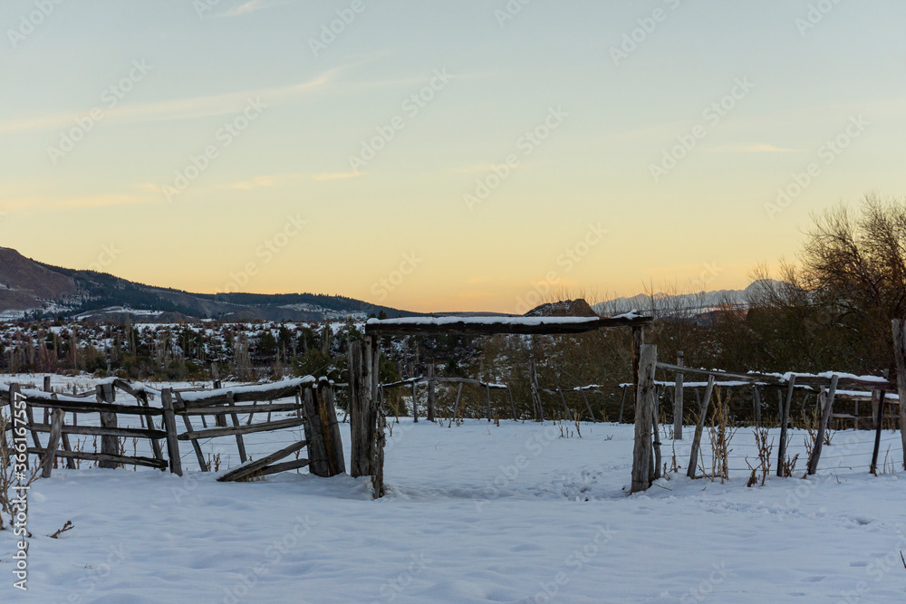 Naklejka premium Scene view of a farm covered by snow during winter season in Patagonia