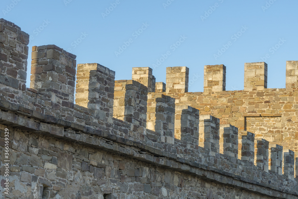 Elements of an ancient fortress. ancient city. Fortress on the rocks. Ruined walls of a medieval castle on the mountain. Crimea, Sudak Elements of an ancient fortress. ancient city. Fortress on the rocks. Ruined walls of a medieval castle on the mountain. Crimea, Sudak