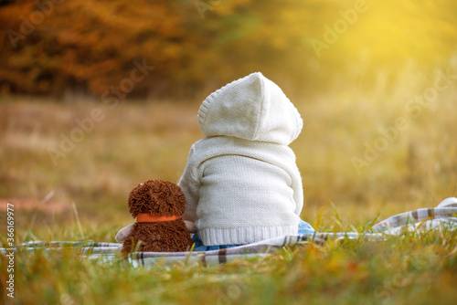 Little girl in autumn park. photo