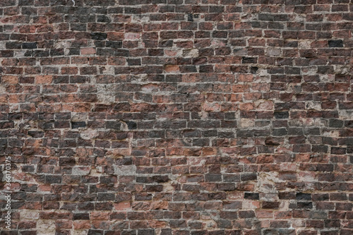 Valokuvatapetti Old red brick damaged wall background and exposed brickwork texture