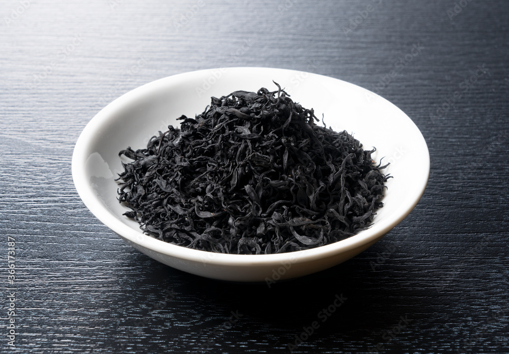 Dried hijiki on a black background Dried hijiki on a black background
