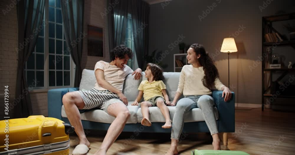 Funny happy young asian family is having fun together, packing their suitcases and bags for vacational flight, parents and kid with curly hair preparing for an adventure 4k footage Funny happy young asian family is having fun together, packing their suitcases and bags for vacational flight, parents and kid with curly hair preparing for an adventure 4k footage