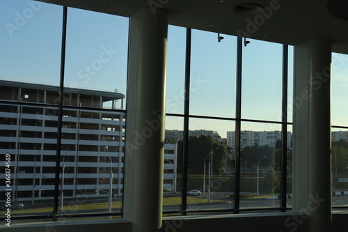 office transparent glass with buidling view © Mikalai Drazdou