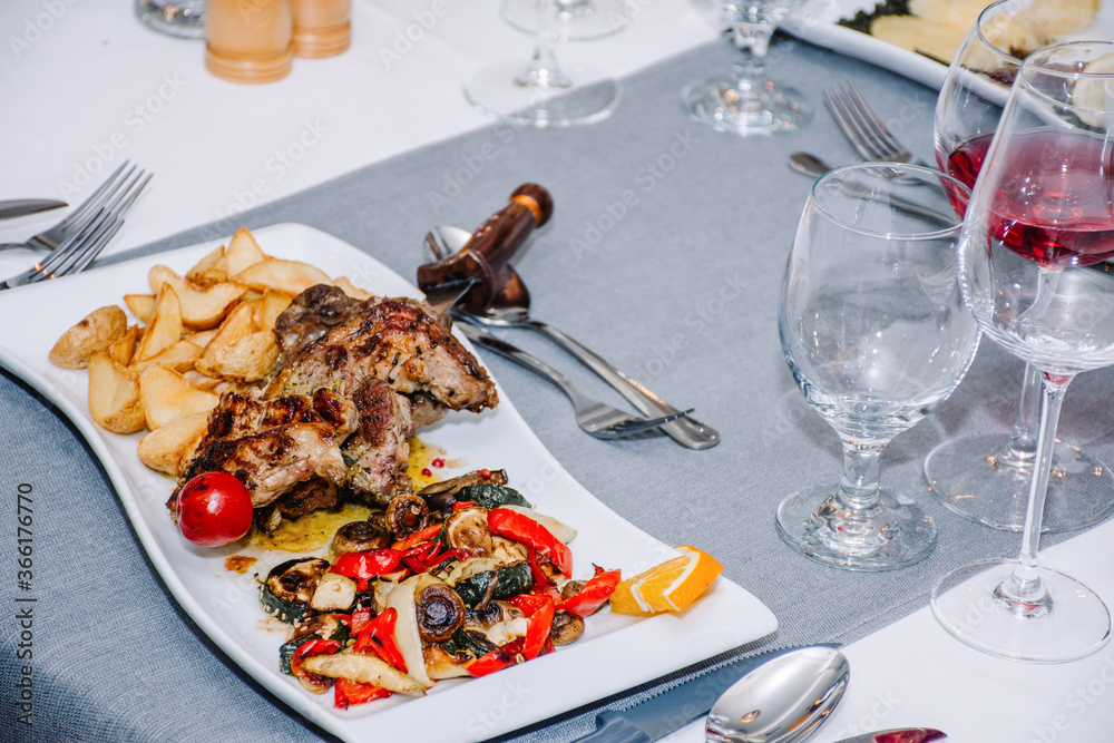 Dish served with delicious roasted chicken, vegetables and french fries Dish served with delicious roasted chicken, vegetables and french fries