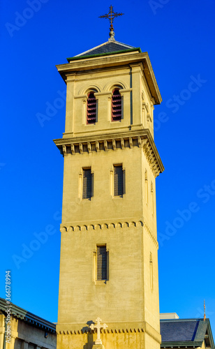 The bell tower of CHRIST CHURCH in Brunswick, Melbourne, Australia at the golden hour sunset © Adam Calaitzis
