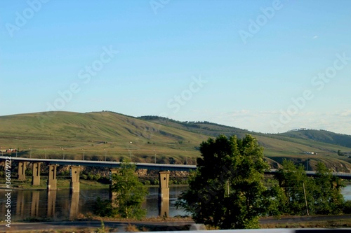sunlit bridge over the Shilka river in Transbaikalia photo