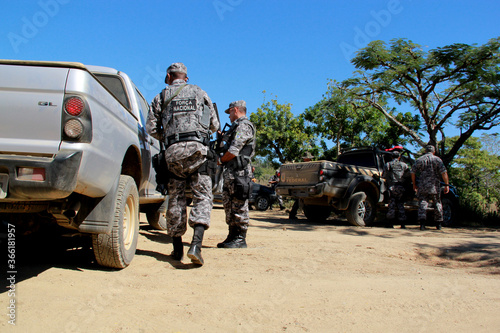 pau brasil, bahia / brazil - april 29, 2012: agents of the National Force are seen during patrol in a rural area of the city of Pau Brasil during conflict between indigenous and local farmers. photo