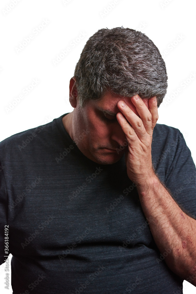 Man with one hand on his head defeated with a black T-shirt Man with one hand on his head defeated with a black T-shirt