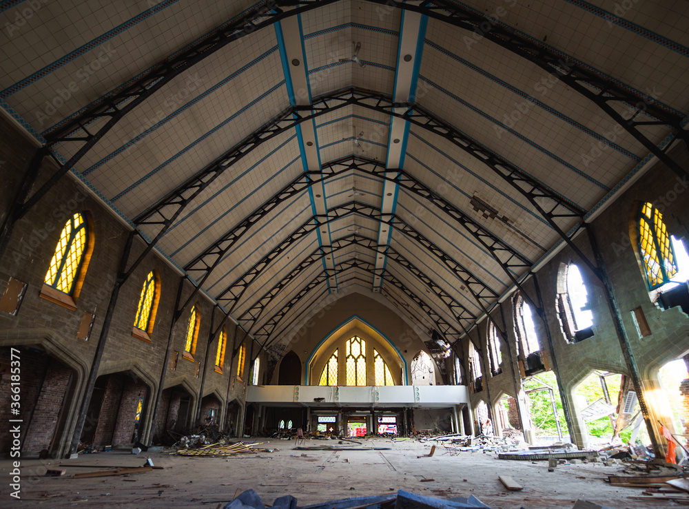 interior of an abandoned church with high roof