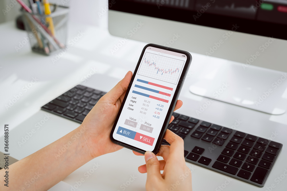 Stock exchange market concept, hand trader looking smartphone with graphs analysis candle line, diagrams on screen. Stock exchange market concept, hand trader looking smartphone with graphs analysis candle line, diagrams on screen.