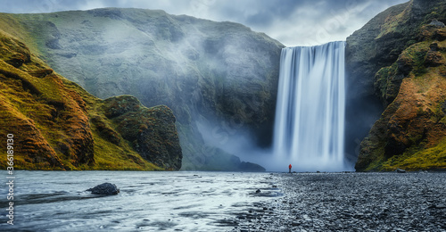 Fototapeta Naklejka Na Ścianę i Meble -  Icelandic Landscape. Classic long exposure view of famous Skogafoss waterfall with colorful sky during sunset. Skoga river, highlands of Iceland, Europe. Popular Travel destinations. Amazing nature