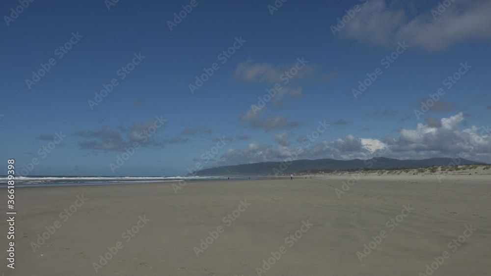 The beach and the Siuslaw River along the Oregon coast near Harbor Vista, Oregon, at the Siuslaw North Jetty.