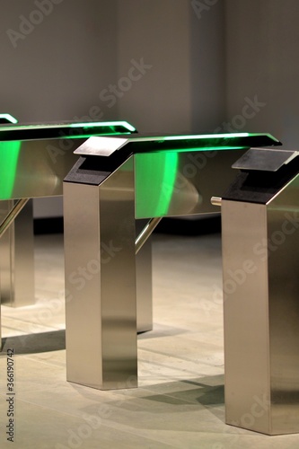 Rotating metal turnstiles for access control