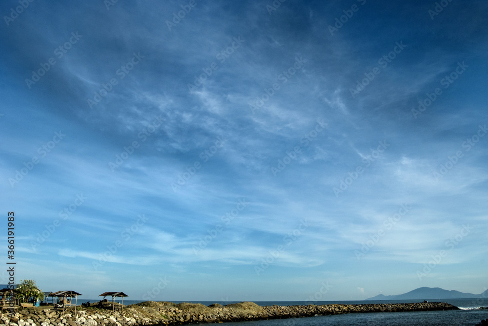 calm clouds over the river beside the beach calm clouds over the river beside the beach