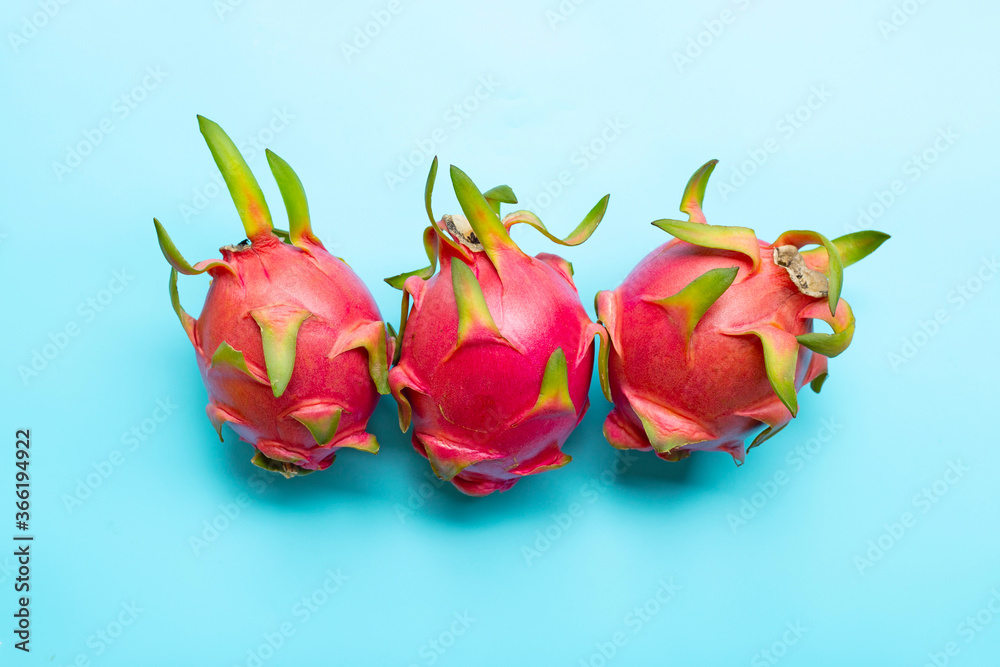 Dragon fruit or pitaya on blue background. Delicious tropical exotic fruit Dragon fruit or pitaya on blue background. Delicious tropical exotic fruit