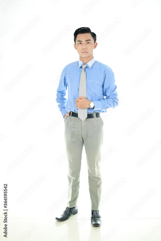 Confidence and business concept. Portrait of charming successful young entrepreneur in blue-collar shirt, smiling broadly with self-assured expression isolated White Background. Indonesian People Confidence and business concept. Portrait of charming successful young entrepreneur in blue-collar shirt, smiling broadly with self-assured expression isolated White Background. Indonesian People