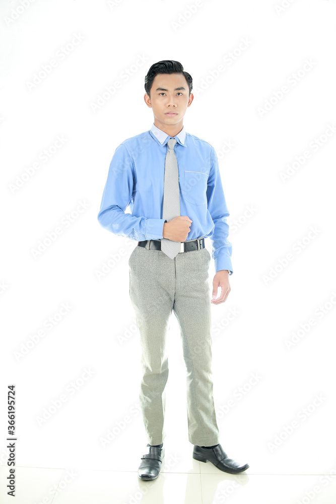 Confidence and business concept. Portrait of charming successful young entrepreneur in blue-collar shirt, smiling broadly with self-assured expression isolated White Background. Indonesian People