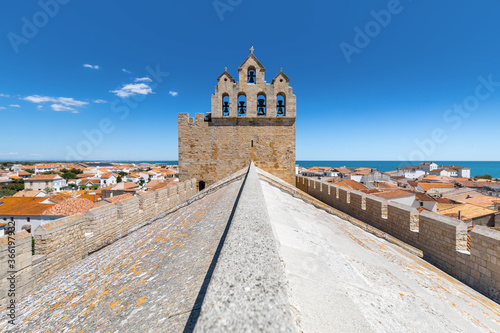 Wallpaper Mural Symmetrical wide angle view of the rooftop of the french church of Saintes Maries de la Mer, against a blue summer sky Torontodigital.ca