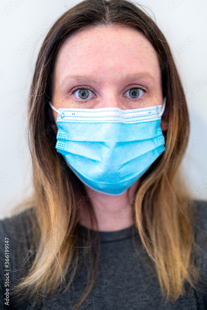 portrait of a young woman wearing a mask portrait of a young woman wearing a mask