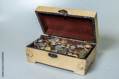 small carved box with old coins