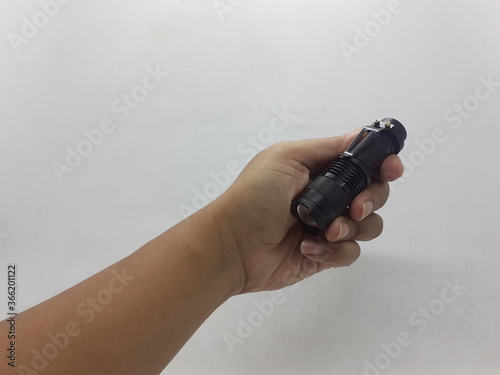 Black Military Style Technical Stainless Steel LED Bright Electric Flashlight in White Isolated Background