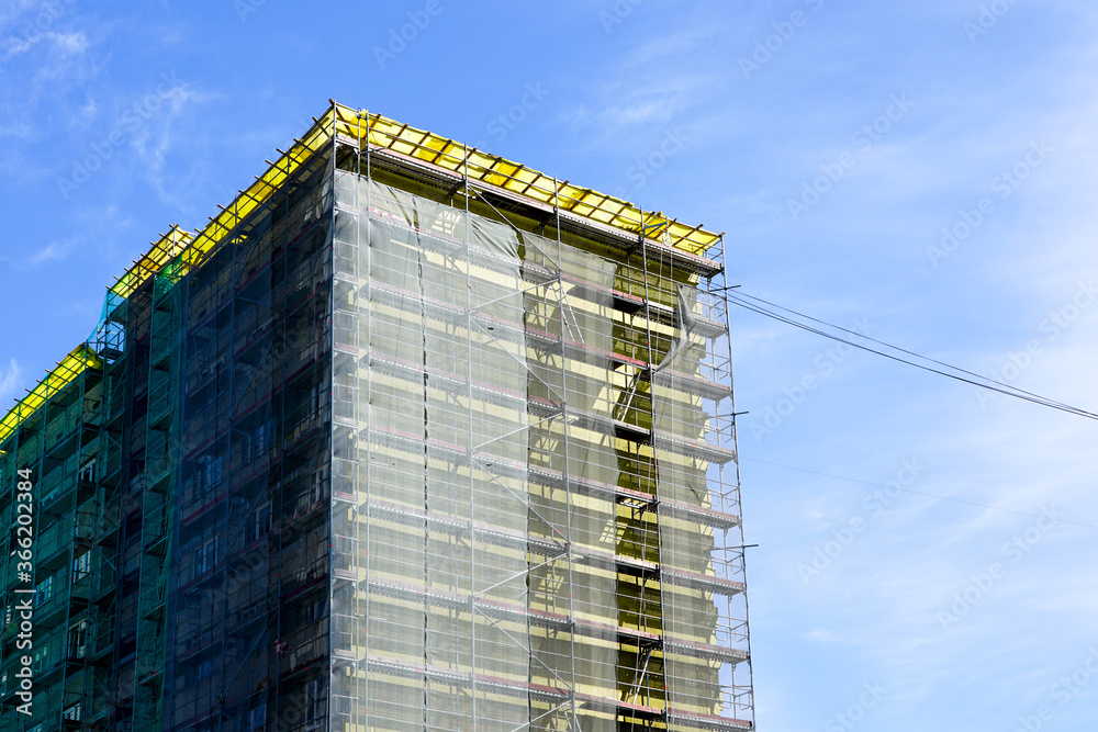 apartment house facade renovation and thermal insulation, scaffolding